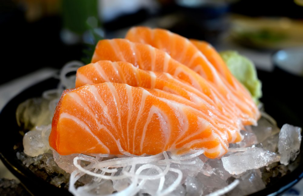 salmon sashimi on a bed of daikon